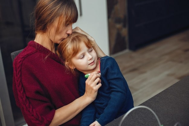 A parent is gently comforting a toddler who is upset, while maintaining a calm and reassuring facial expression. They are kneeling to be at the child's eye level.