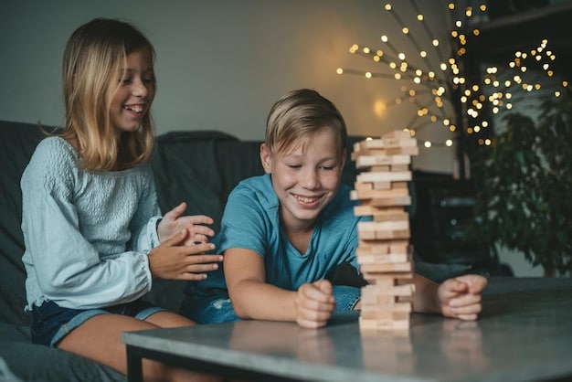 A father and daughter are laughing together while building a Lego tower on the living room floor. The scene is brightly lit and shows a clear sense of joy and connection.