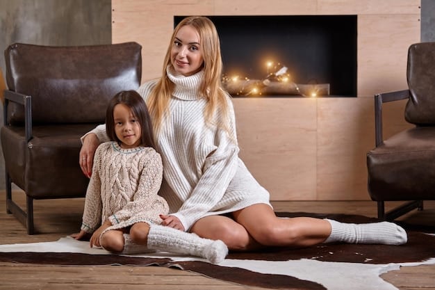 A mother and her young daughter are sitting on the floor in their living room. The mother is holding a ukulele and showing her daughter how to strum it. The daughter is watching attentively and smiling. There are other musical instruments around them, such as a xylophone and a recorder. The room is brightly lit and decorated with colorful artwork.