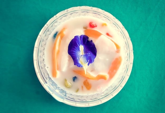 A close-up shot of a petri dish filled with milk, where vibrant swirls of different colors are forming as a result of the interaction between the milk, food coloring, and dish soap.