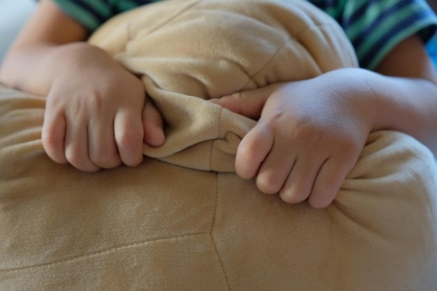 A close-up shot of children's hands working together to secure a blanket over chairs in a fort-building project, highlighting collaboration and teamwork.