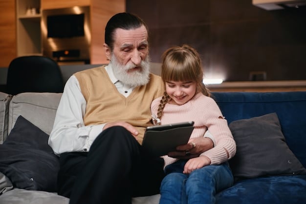 A young child sitting on a grandparent's lap, both smiling and looking at a tablet displaying a digital family tree.