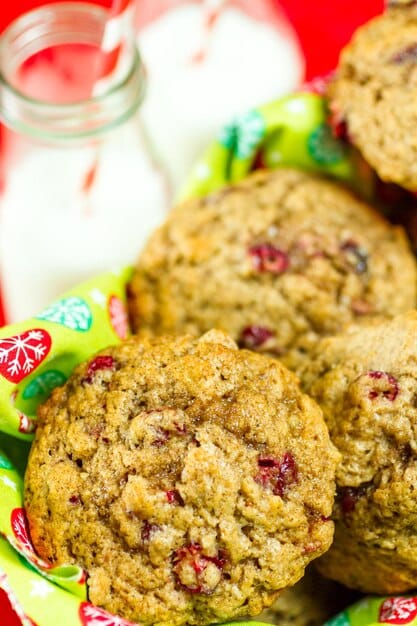 A display of various baked goods, including muffins, breads, and cookies, with visible hints of vegetables like shredded carrots or green specks from spinach, all presented attractively.