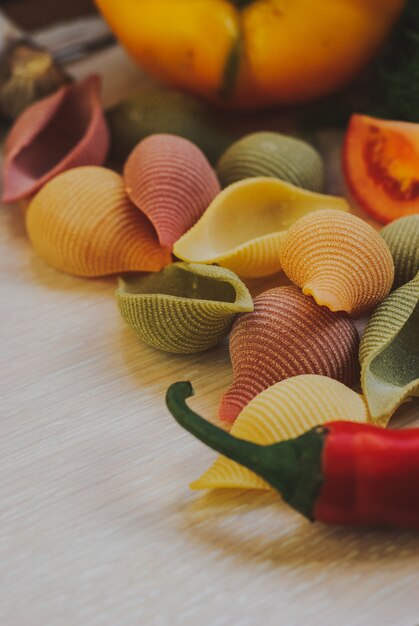 A close-up shot of a vibrant Pasta Primavera dish, showcasing a variety of colorful vegetables like broccoli, carrots, peas, and bell peppers mixed with perfectly cooked pasta. The dish is garnished with fresh basil leaves and a sprinkle of parmesan cheese, highlighting its fresh and appealing appearance.