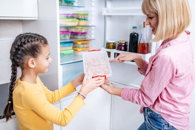 A parent carefully labeling containers of frozen baby food with the date and contents, showcasing organized and safe storage practices in the freezer.