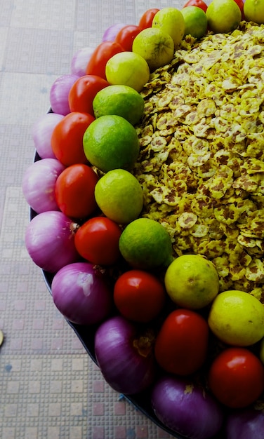 A close-up shot of a diverse selection of colorful vegetables, fruits, and whole grains arranged on a plate, presented in an appealing and playful way. The image should emphasize the variety of textures, colors, and shapes of healthy foods.