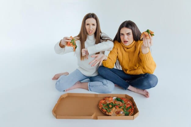 A worried mom packing a lunchbox while her child sits at the table, looking unenthusiastic.