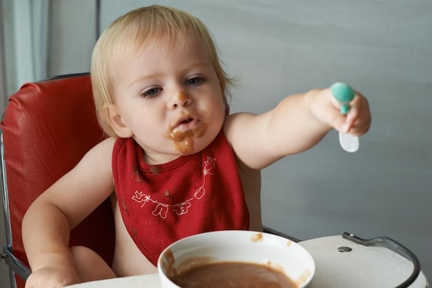 A baby happily eating a spoonful of cold applesauce, with a contented expression on their face. The focus is on the baby's positive reaction to the soothing food.