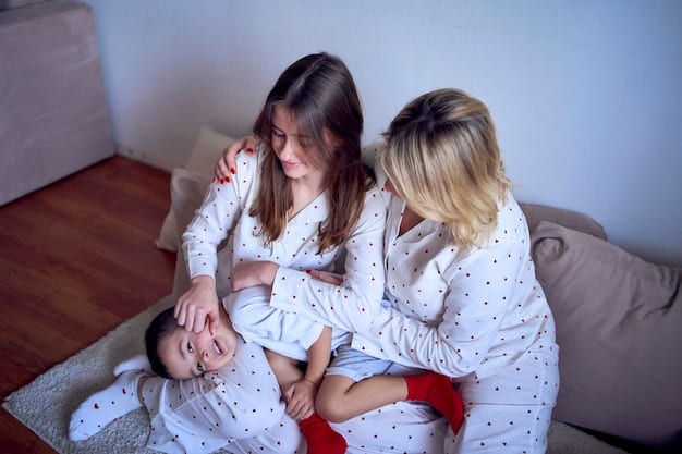 A photo of a mother holding her three-month-old baby upright, supporting the baby's chest and neck as the baby attempts to hold their head steady. The mother is smiling encouragingly.