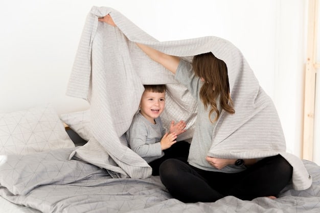 A parent playing peek-a-boo with their baby behind a blanket, illustrating a fun and reassuring game to ease separation anxiety. Both are smiling and engaged.