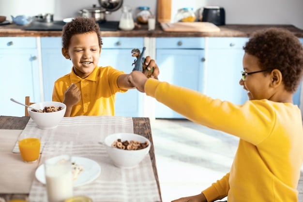 A parent offering two options of healthy snacks to their toddler, who is smiling and pointing at one of the choices. The scene is set in a bright and inviting kitchen.