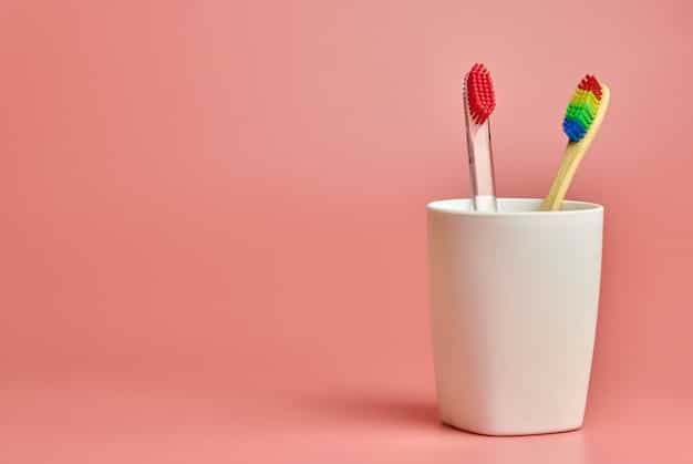 A tube of a doctor-recommended, baby-safe gum-numbing gel, displayed next to a soft infant toothbrush, with a clean and sanitary background.