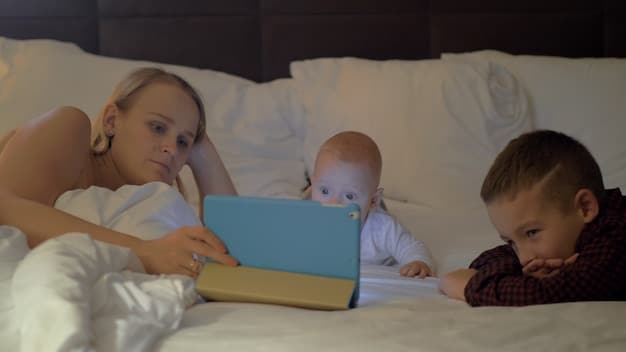 A baby happily engaging in a calm bedtime routine with their parent, such as reading a book together in soft lamplight.