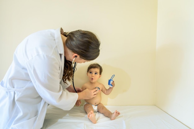 A doctor examining a baby's skin during a check-up, emphasizing the importance of professional guidance in managing eczema and other skin conditions.