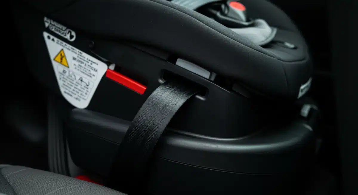 Close-up of car seat LATCH system installation, demonstrating proper securement for optimal child safety.