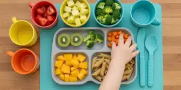 Colorful and nutritious toddler meal on a placemat, with small hands reaching for food, approved by pediatricians for healthy growth.